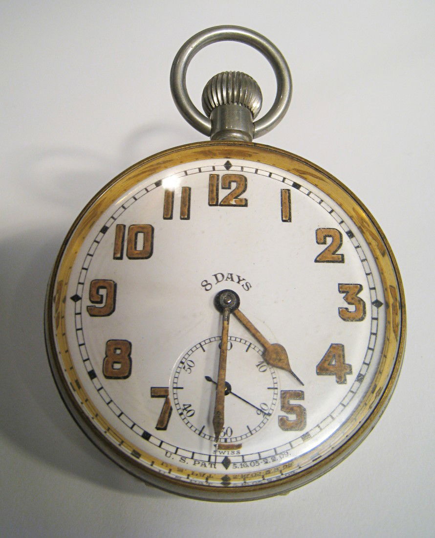 Eight Day Pocket Watch: A larger early 20th century nickel cased pocket watch with radium and porcelain dial 70mm in diameter, with an eight day jeweled movement by Doxa. Stem wind, stem set. Shipping: We are able to pack an