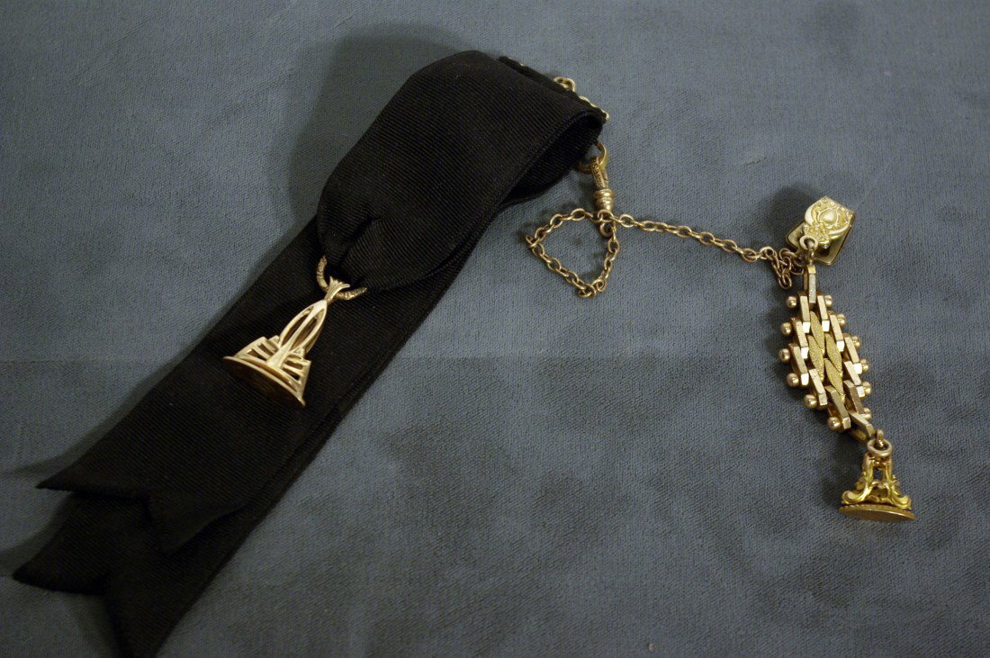 Watch Fobs: One with a black ribbon and a gold fob marked "S"; the other with a vest pocket clip and a smaller fob blank of engraving. Shipping: We are able to pack and ship this item to an address in the United 