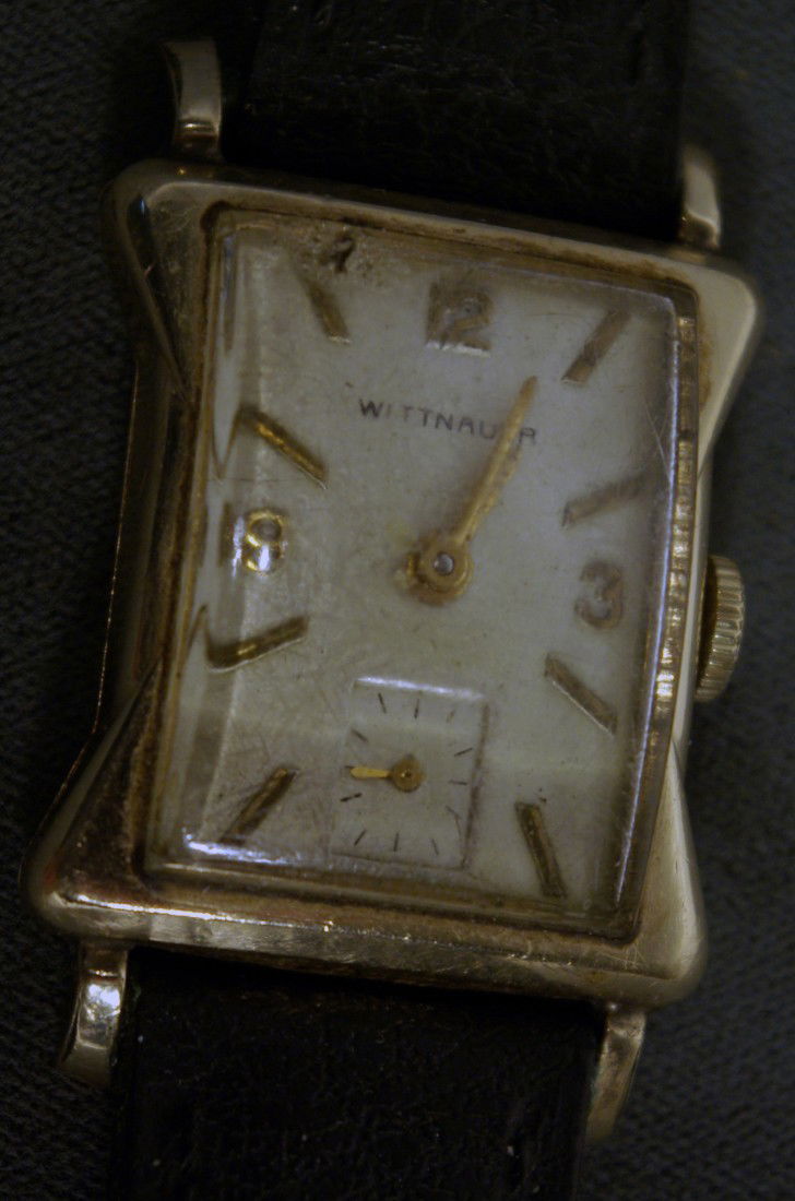 Wittnauer Men's Wrist Watch: With a black strap. Gold filled case. Running Shipping: We are able to pack and ship this item to an address in the United States for $15.00 via USPS Priority Mail. Tracking information will be sent t