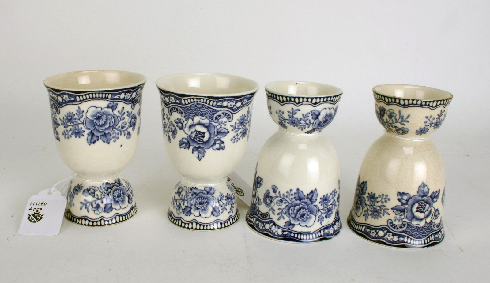 FOUR VINTAGE BLUE & WHITE EGG CUPS: FOUR VINTAGE BLUE & WHITE EGG CUPS </