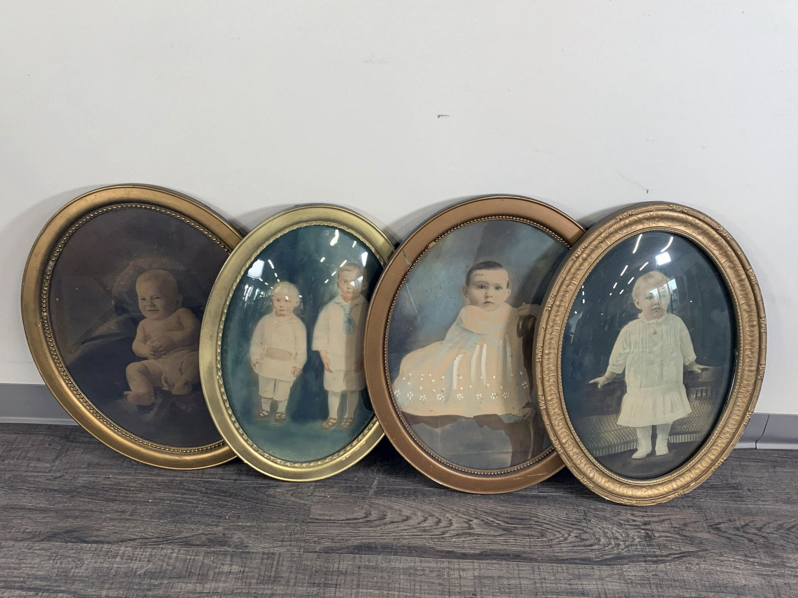 FOUR OVAL VINTAGE PORTRAITS IN CONVEX BUBBLE GLASS FRAMES (1 of 1)