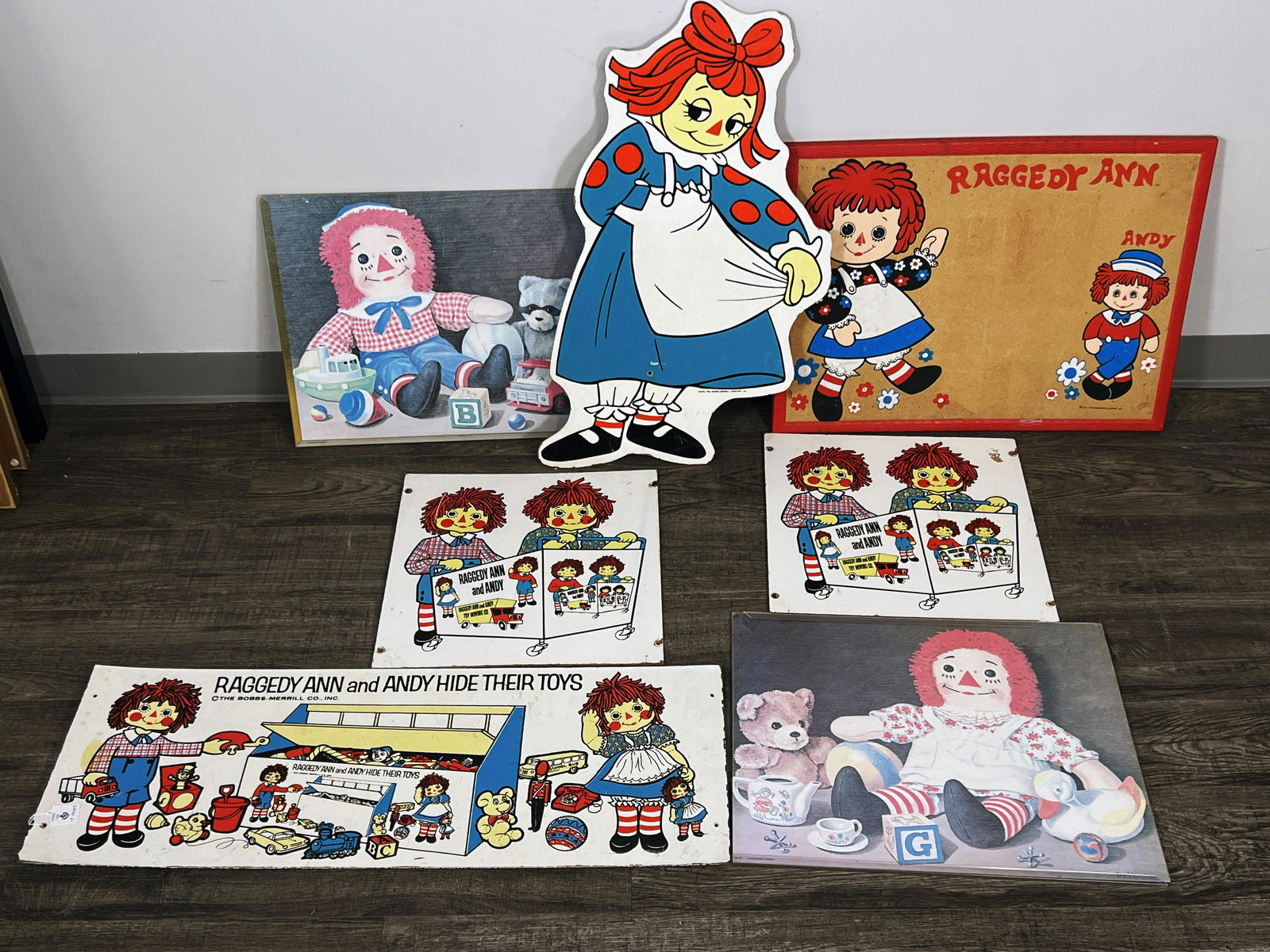 VINTAGE RAGGEDY ANN & ANDY '74 BOBBS MERRILL CORKBOARD, FRAMED PRINTS LOT: VINTAGE RAGGEDY ANN & ANDY '74 BOBBS MERRILL CORKB