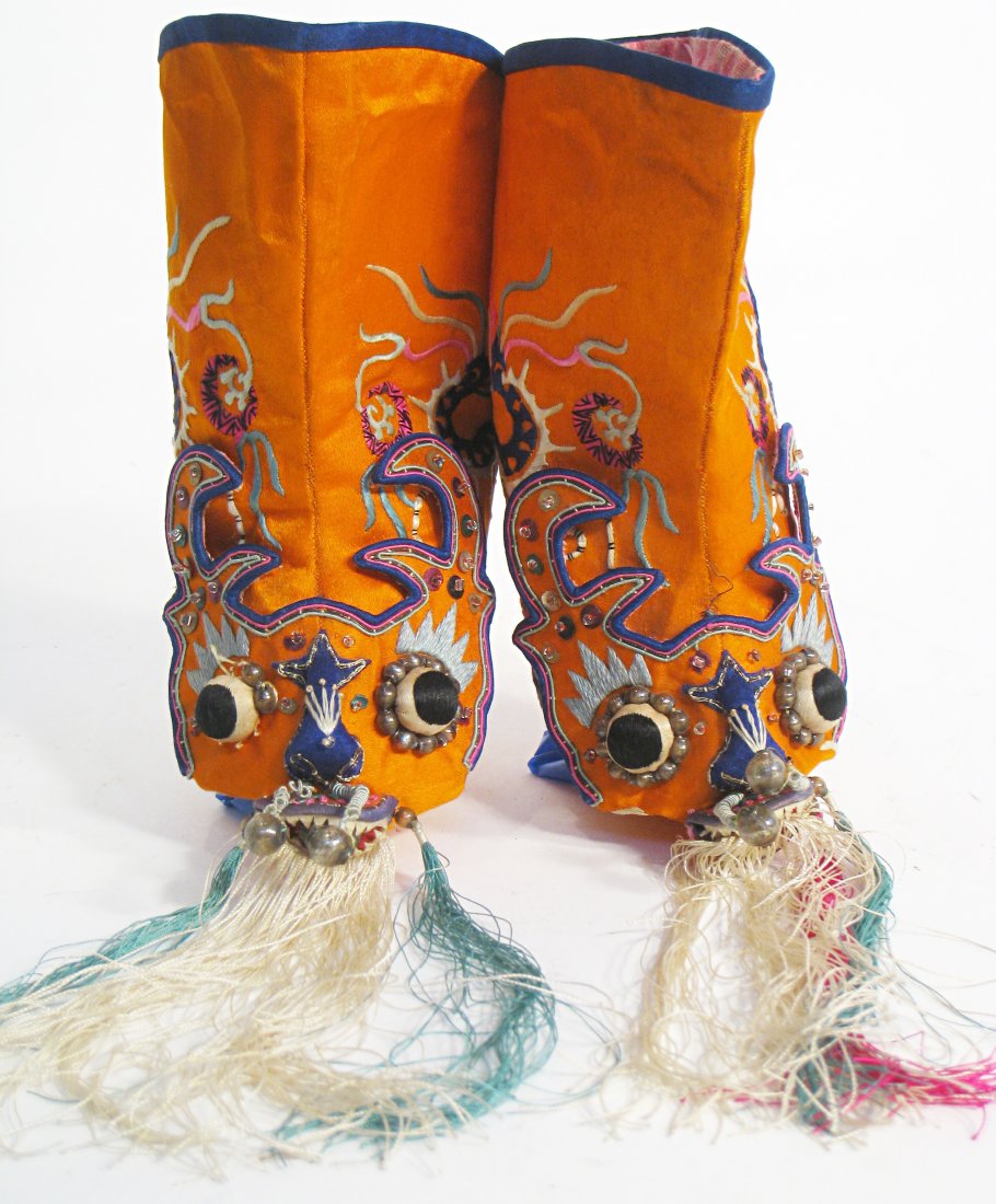 Boots: A hand embroidered pair of infant boots, about 6" tall. Shipping: We are able to pack and ship this item to an address in the United States for $25.00 via USPS Priority Mail. Tracking information will