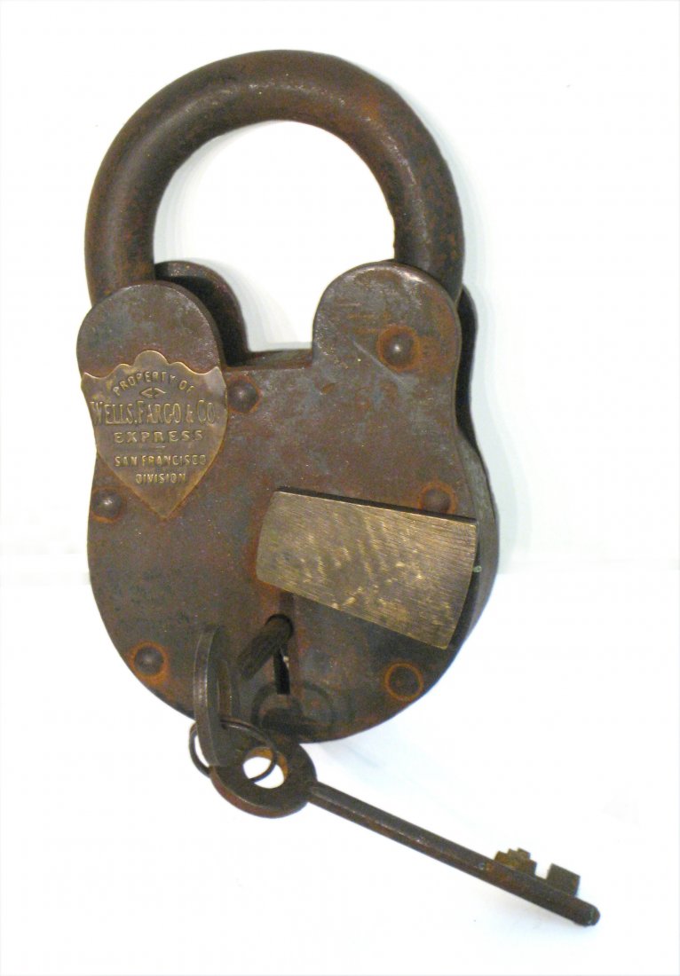 Old Time Padlock By Wells Fargo: The kind that locked up the "payroll" box ridin' on the sage, that the bad guys robbed and shot open with their pistols. Only this one survived: it wasn't shot open and actually has the original worki