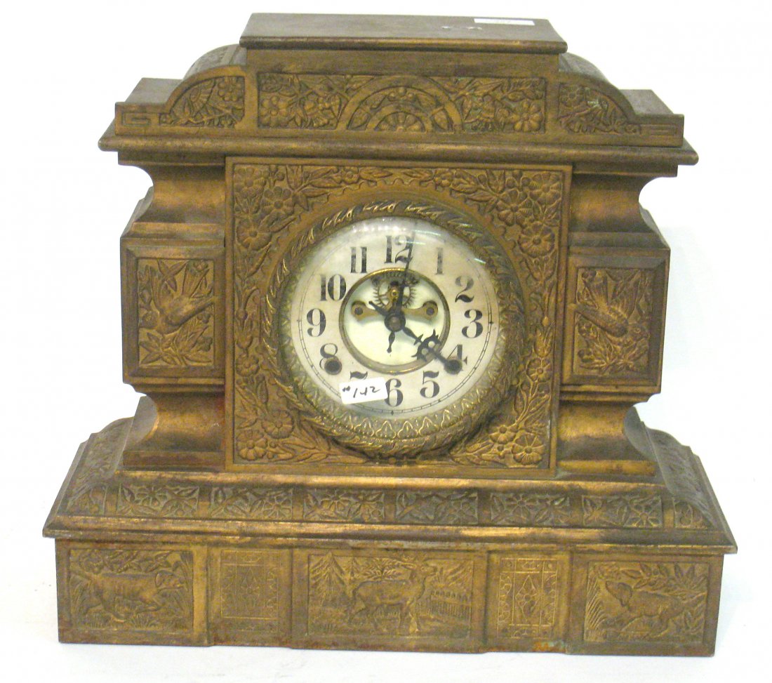 Brass Cased: Metal cased mantel clock of the alte 1800s by Gilbert with an outside escapement. Shipping: We are able to pack and ship this item to an address in the United States for $55.00 via USPS Priority Mail 