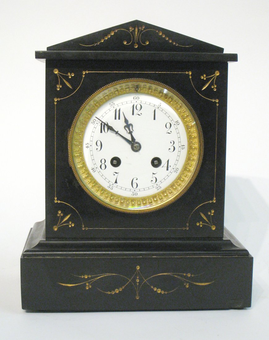 French Mantel Clock: With a Blegain slate casement, white porcelain round dial, 11" in height. Lacking pendulum. Shipping: We are able to pack and ship this item to an address in the United States for $50.00 via USPS Prio