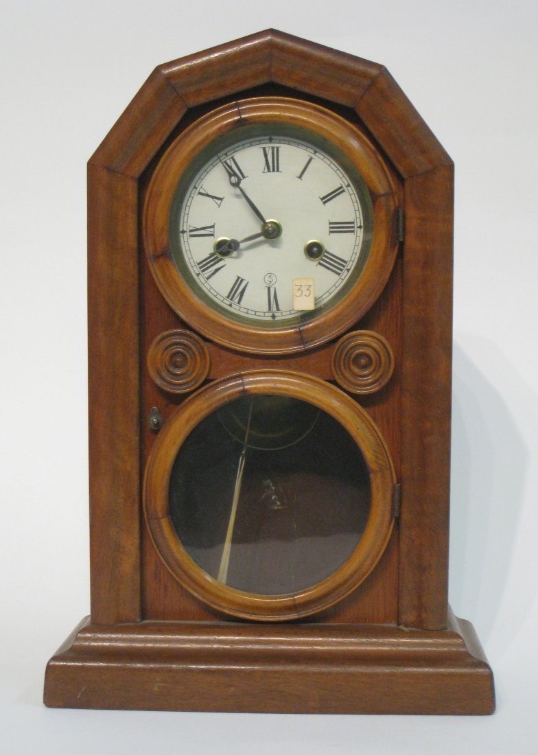 Shelf Clock: An American shelf clock with reverse painted glass now cleared. 19th century (pendulum bob is available). Shipping: We are able to pack and ship this item to an address in the eastern states for $50.0