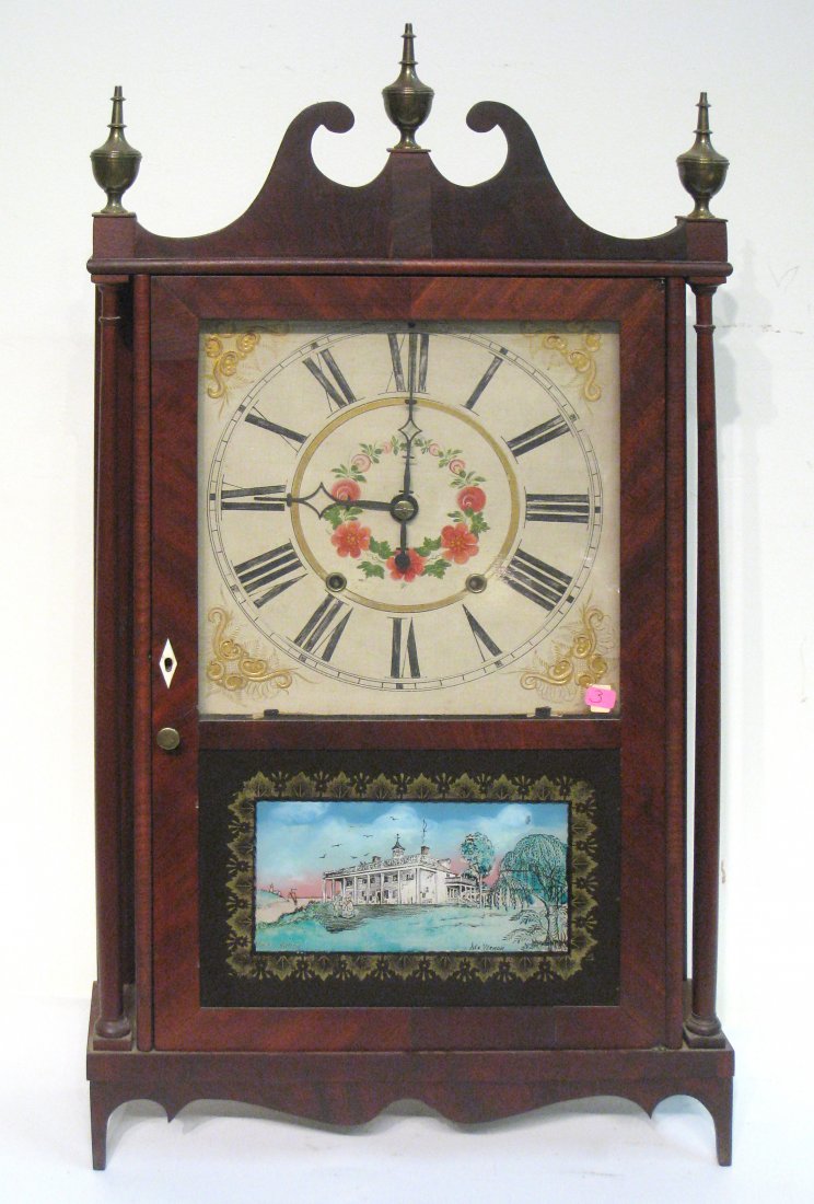 Terry Clock: A early 19th century "Terry" or "Pillar and Scroll" shelf clock, 32" in height, labeled inside with the maker's name "Ephriam Downs" featuring brass urn finials, a later reverse painted glass door. Sh