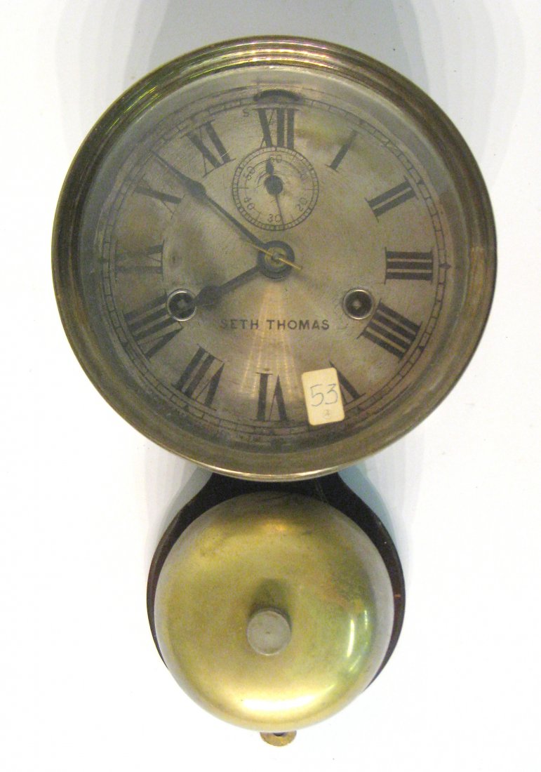 Ships Bell Clock: A American late 19th century brass and silvered brass ships bells clock by Seth Thomas with the "outside bell" feature. Shipping: We are able to pack and ship this item to an address in the United Sta