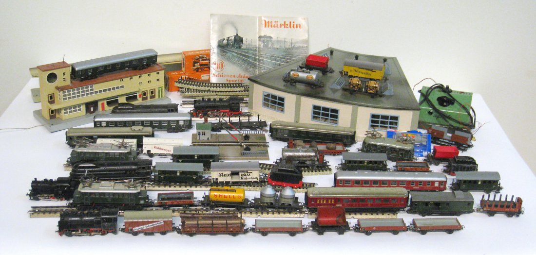 OO Guage Train Set: A train set by Markel with a transformer, tracks, buildings, and accessories for the various train cars. Shipping: We are able to pack and ship this item to an address in the United States for $55.00 