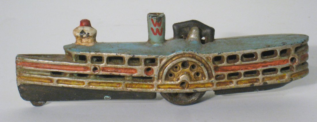 Cast Iron Bank: In the form of a side paddle riverboat, with original paint. Shipping: We are unable to ship this item. Please contact our local UPS Store, store1152@theupsstore.com, for a quote. Please be sure and i