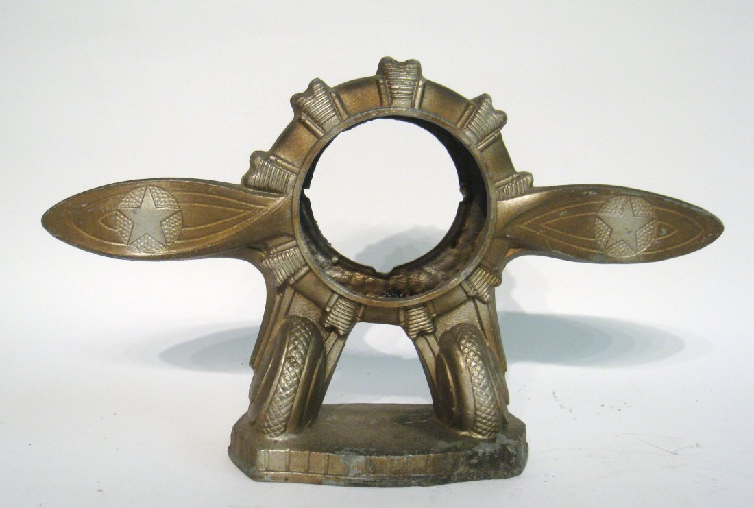 Propellor Style Clock Stand: A clock or instrument stand for mounting in the form of an early 20th century airplane propellor. Shipping: We are able to pack and ship this item to an address in the United States for $50.00 via USP