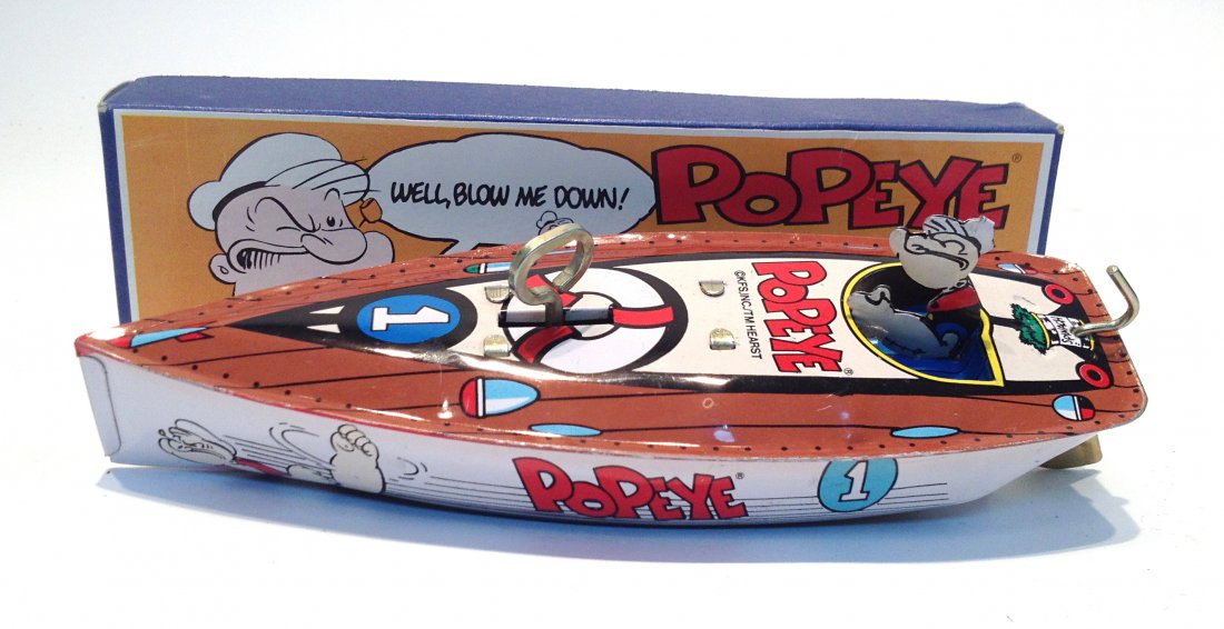 Popeye Toy Speedboat: Mechanical and a recent reproduction., in original box and 7 1/2" in length. Shipping: We are able to pack and ship this item to an address in the United States for $25.00 via USPS Priority Mail. Trac