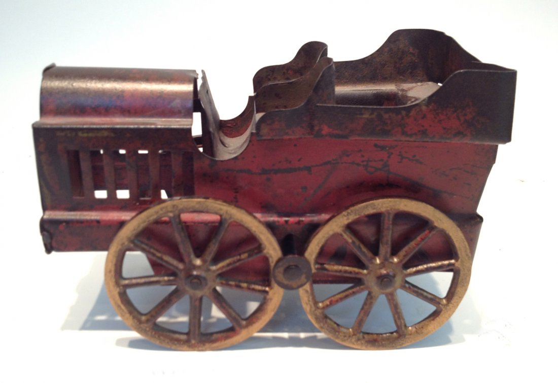 Red Toy Motorcoach: Painted metal toy, 7 3/4" in length Shipping: We are able to pack and ship this item to an address in the United States for $25.00 via USPS Priority Mail. Tracking information will be sent to your ema