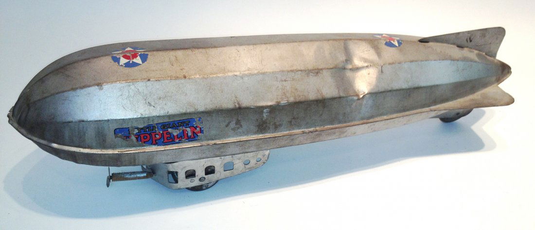"Little Giant" Model Zeppelin: A 24" model of an Army Air Corps dirigible made by Zeppelin in the 1930s. The pull toy has a dent on the port side of her fuselage, as seen in the photo Shipping: We are unable to ship this item. Plea