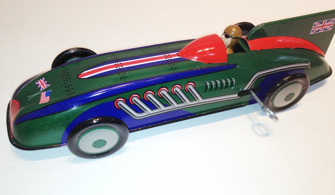 Landspeed Record Car By Schylling Toys: An 11" sleek model with wind up power by Schylling Toys, in mint condition. Shipping: We are able to pack and ship this item to an address in the United States for $40.00 via USPS Priority Mail or via