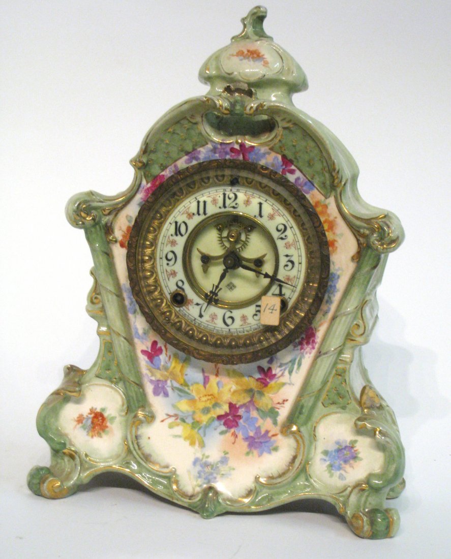 Porcelain Clock: An eight day running porcelain clock with an outside escapement by Ansonia. Shipping: We are able to pack and ship this item to an address in the United States for $50.00 via USPS Priority Mail or via