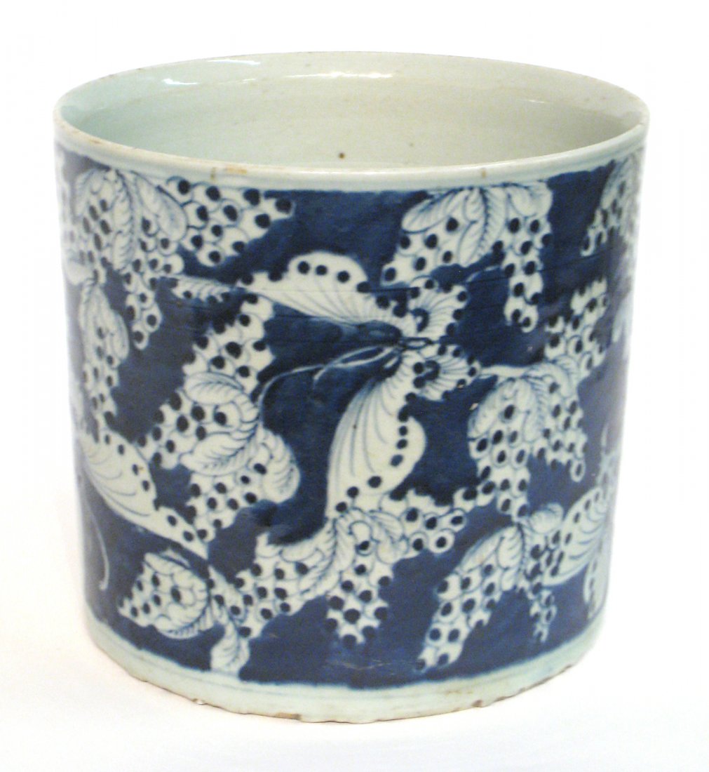 Chinese Antique Porcelain Blue & White Brush Pot: 8" X 8 1/2", with near abstract rendering of butterflies and blooming flowers. Shipping: We are able to pack and ship this item to an address in the United States for $40.00 via USPS Priority Mail or 