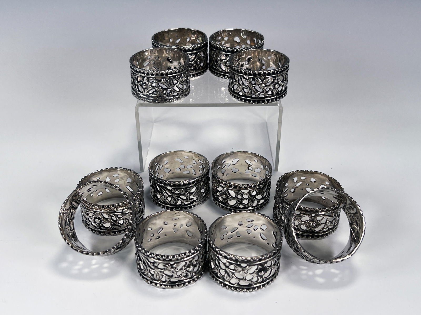 12 PIERCED FLORAL NAPKIN RINGS: 12 PIERCED FLORAL NAPKIN RINGS