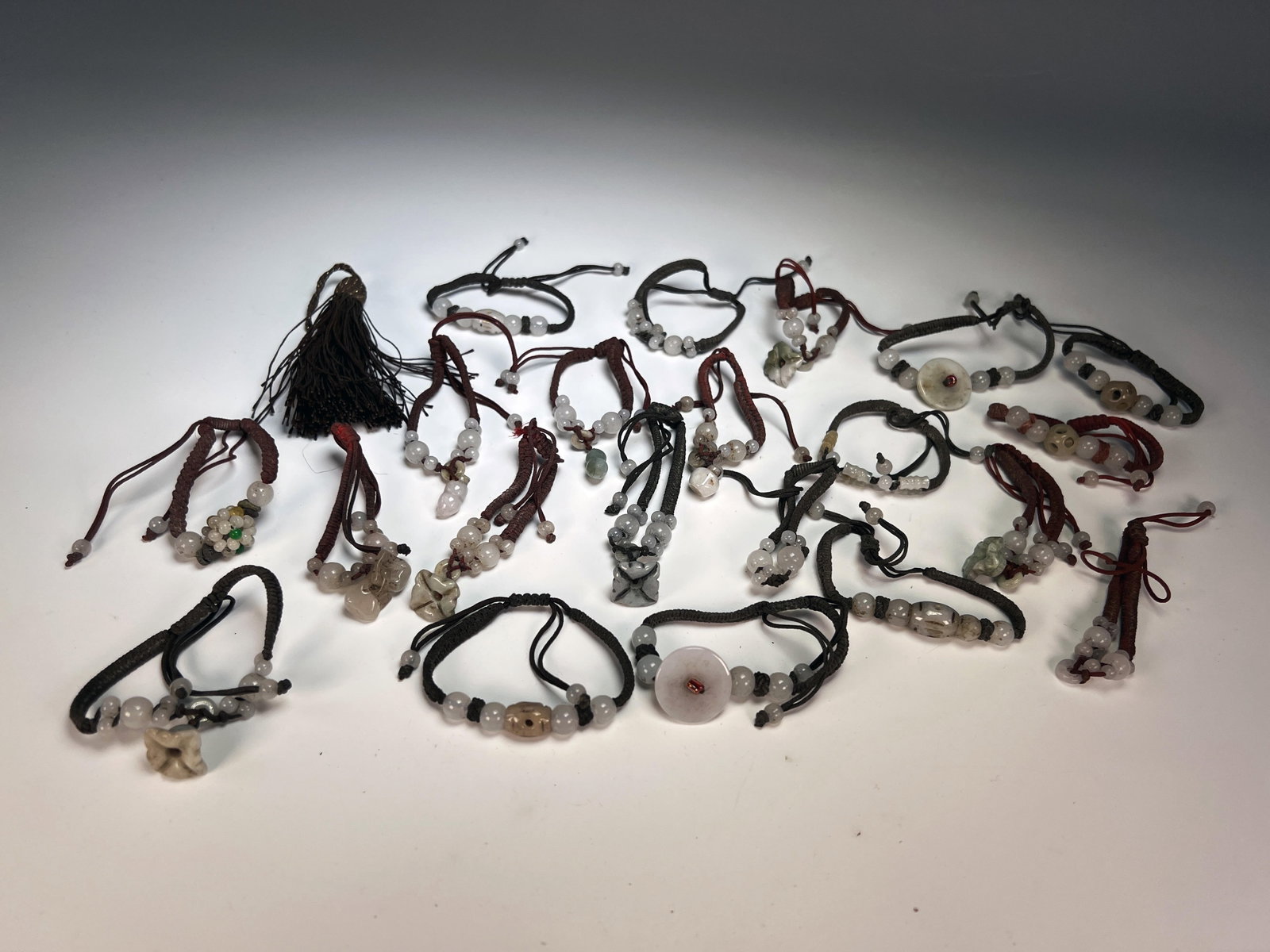 LOT OF JADE BEADS ON CORD: LOT OF JADE BEADS ON CORD