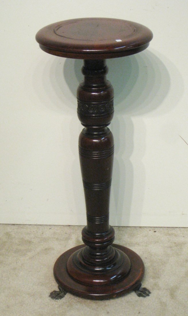 Display Stand: A turned mahogany wood display stand , 36 1/2" high with a round display surface of 14". Shipping: We are unable to ship this item. Please contact our local UPS Store, store1152@theupsstore.com, for a