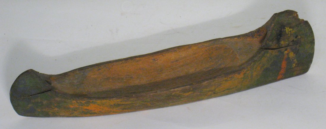 Native American Carved Canoe: A Native American style carved folk art canoe. About 17 1/2" long. Shipping: We are able to pack and ship this item to an address in the United States for $25.00 via USPS Priority Mail. Tracking infor