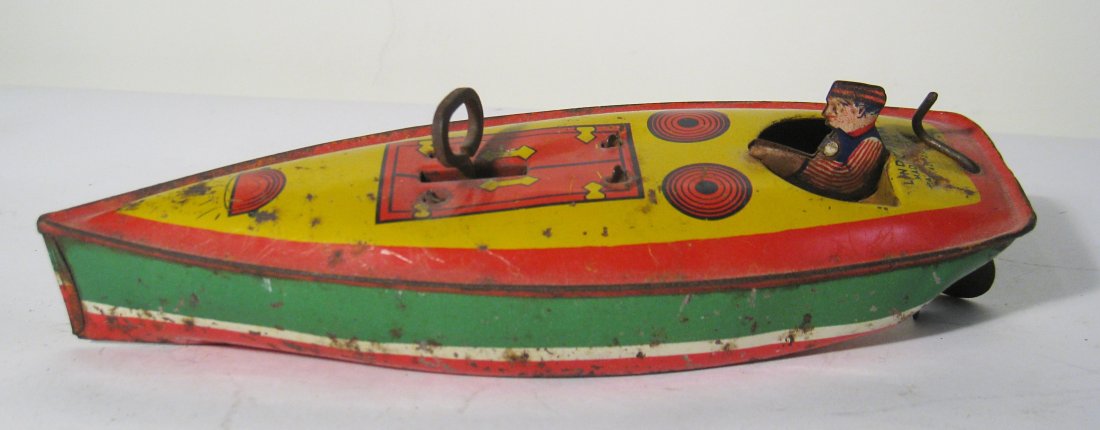 Wind Up Racing Toy Speed Boat: In reds, yellows, greens, and having a moveable rudder in the back. 7". Shipping: We are able to pack and ship this item to an address in the United States for $25.00 via USPS Priority Mail. Tracking 