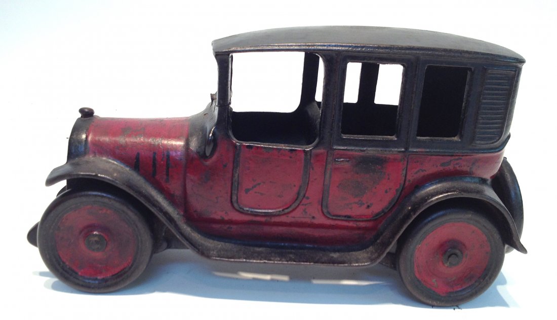 Red And Black Cast Metal Car.: 9 1/2" in length. Shipping: We are able to pack and ship this item to an address in the United States for $25.00 via USPS Priority Mail. Tracking information will be sent to your email address. Each a