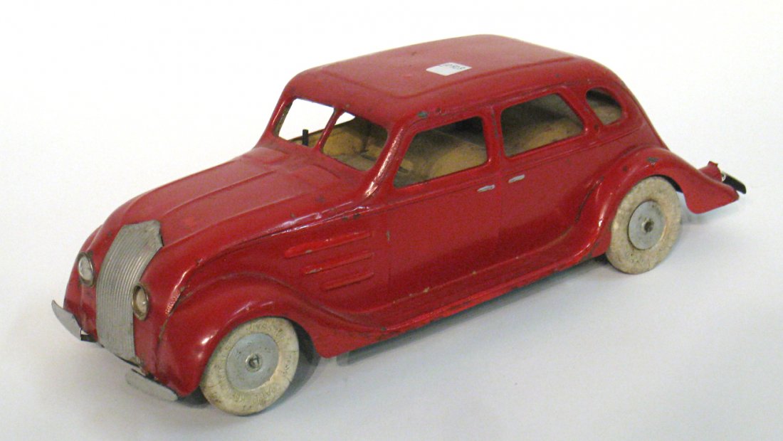 Red Sedan: Battery and clocks works drive. 13 1/2" long. Shipping: We are able to pack and ship this item to an address in the United States for $50.00 via USPS Priority Mail or via FedEx Ground/Home Delivery. T