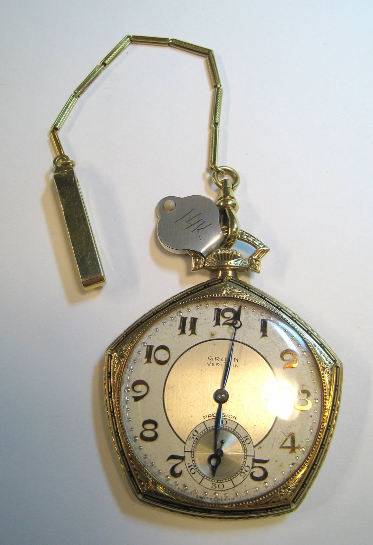 Gruen Dress Watch With Short Chain.: A Gruen pocket watch # 542786 in a 14K gold and enamel five sided case and a short 6" dress chain. The 17 jewel movement, running, dating to the 1930s with an interior inscription presented to a Georg