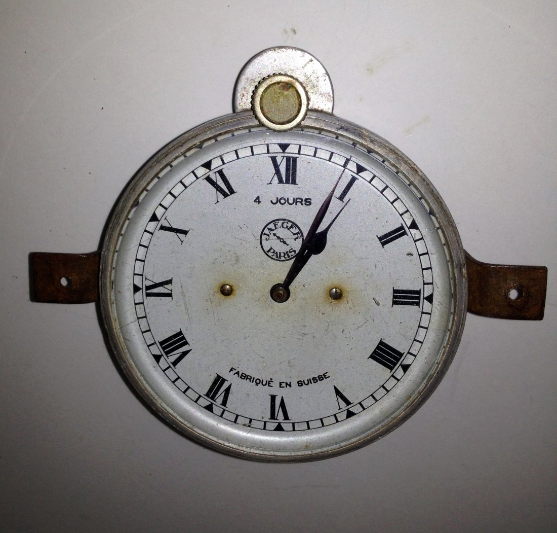 Jaeger Aluminum Cased Car Clock: A high quality 3 1/4" car clock by the Swiss firm for Jaegar of Paris in an aluminum case with winding at 12:00. Probably dating to the 1920s or 30s, the clock does not stay running- maybe because the
