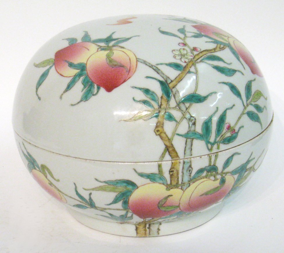 Chinese Famille Rose Large Lidded Bowl: A large bowl with a dome shaped lid, 10 1/4" in diameter, decorated with peach blossoms and multi colored glazes. Shipping: We are able to pack and ship this item to an address in the United States fo