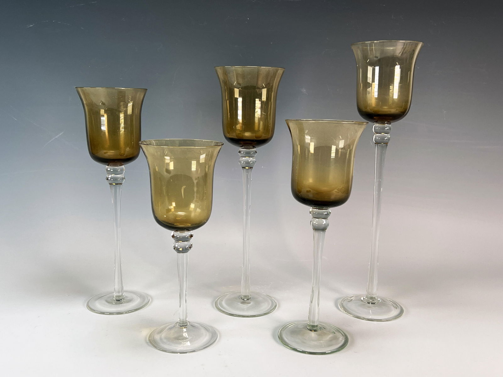TIERED AMBER GLASS CANDLE HOLDERS: TIERED AMBER GLASS CANDLE HOLDERS </