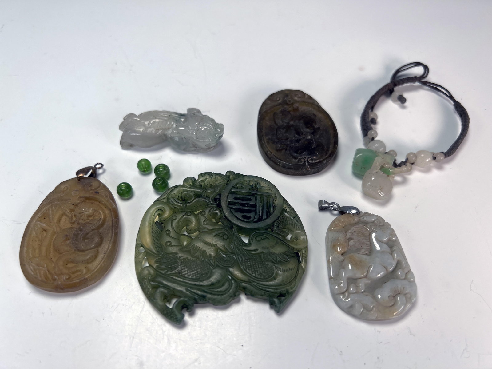CARVED JADE PENDANTS: CARVED JADE PENDANTS
