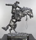 AFTER FREDERIC REMINGTON BRONCO BUSTER SILVER STATUE