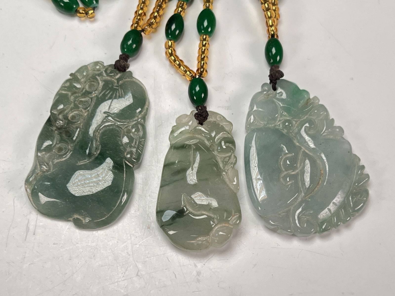 3 CARVED JADE PENDANTS (1 of 2)