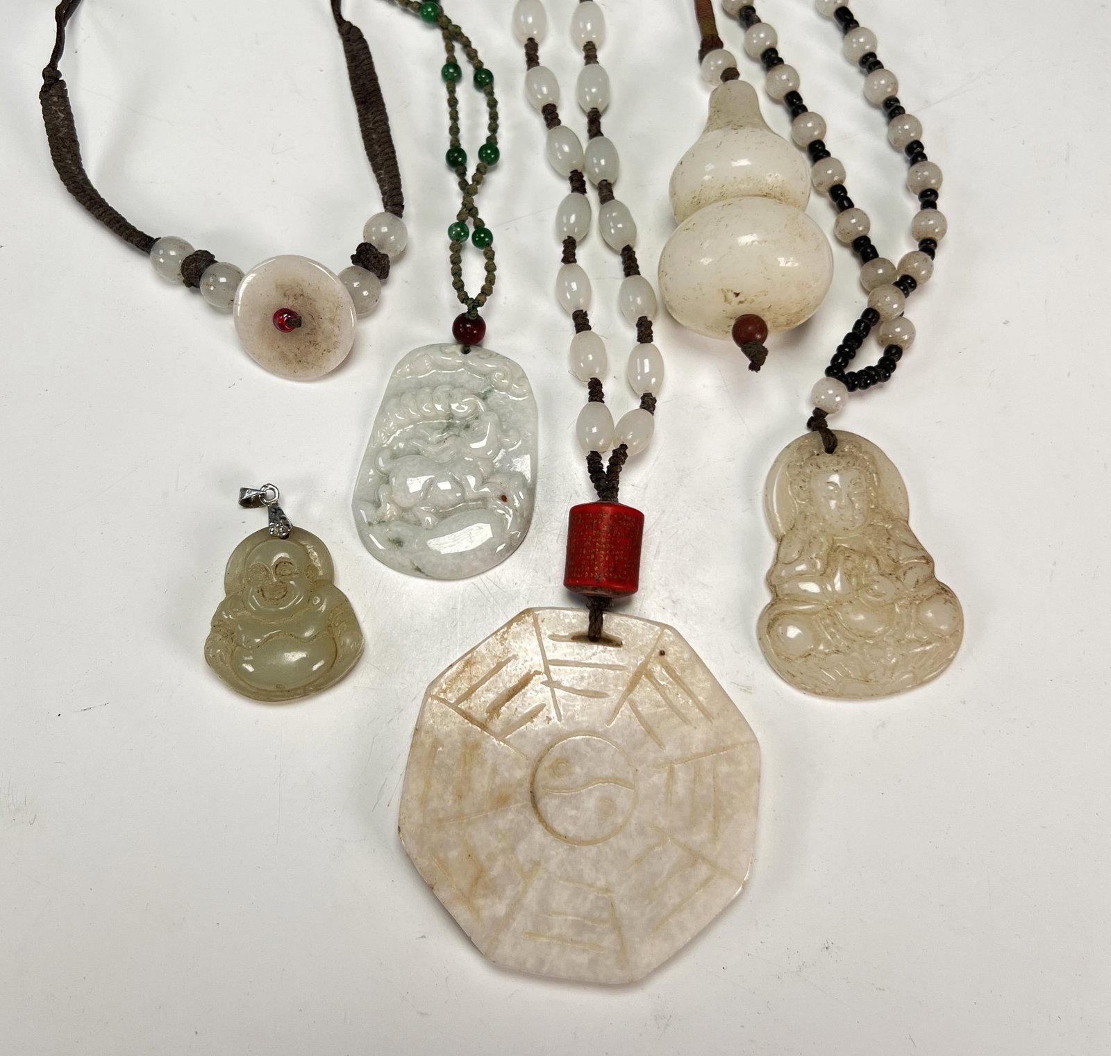 CARVED WHITE JADE PENDANTS