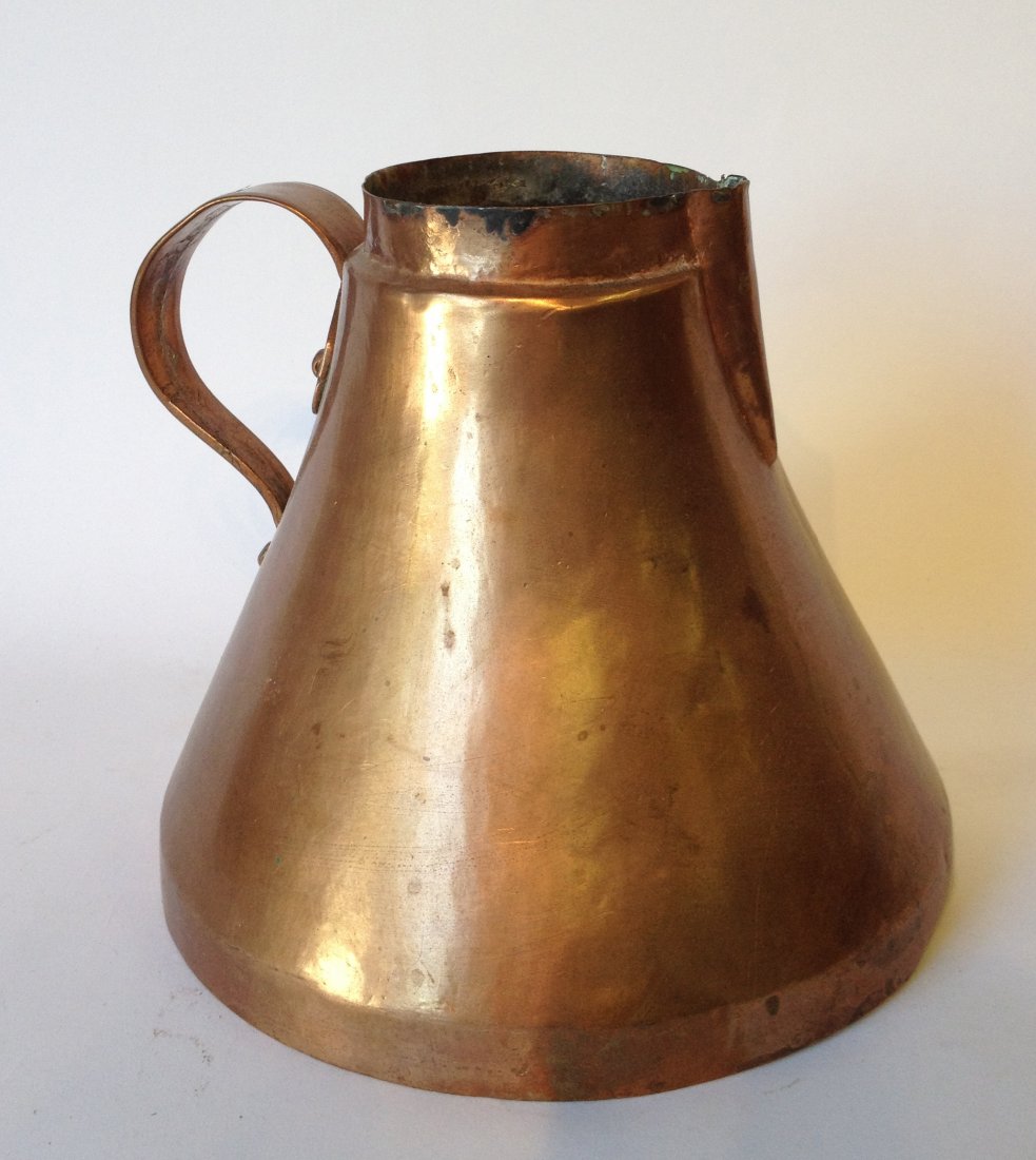 Copper Pitcher: About 7 1/2" tall. Shipping: We are able to pack and ship this item to an address in the United States for $40.00 via USPS Priority Mail or via FedEx Ground/Home Delivery. Tracking information will be