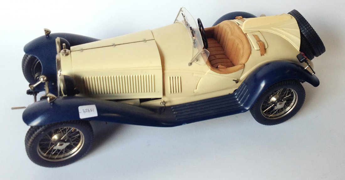 Model Toy Car: About 20" long. Shipping: We are unable to ship this item. Please contact our local UPS Store, store1152@theupsstore.com, for a quote. Please be sure and include your shipping address, a description o