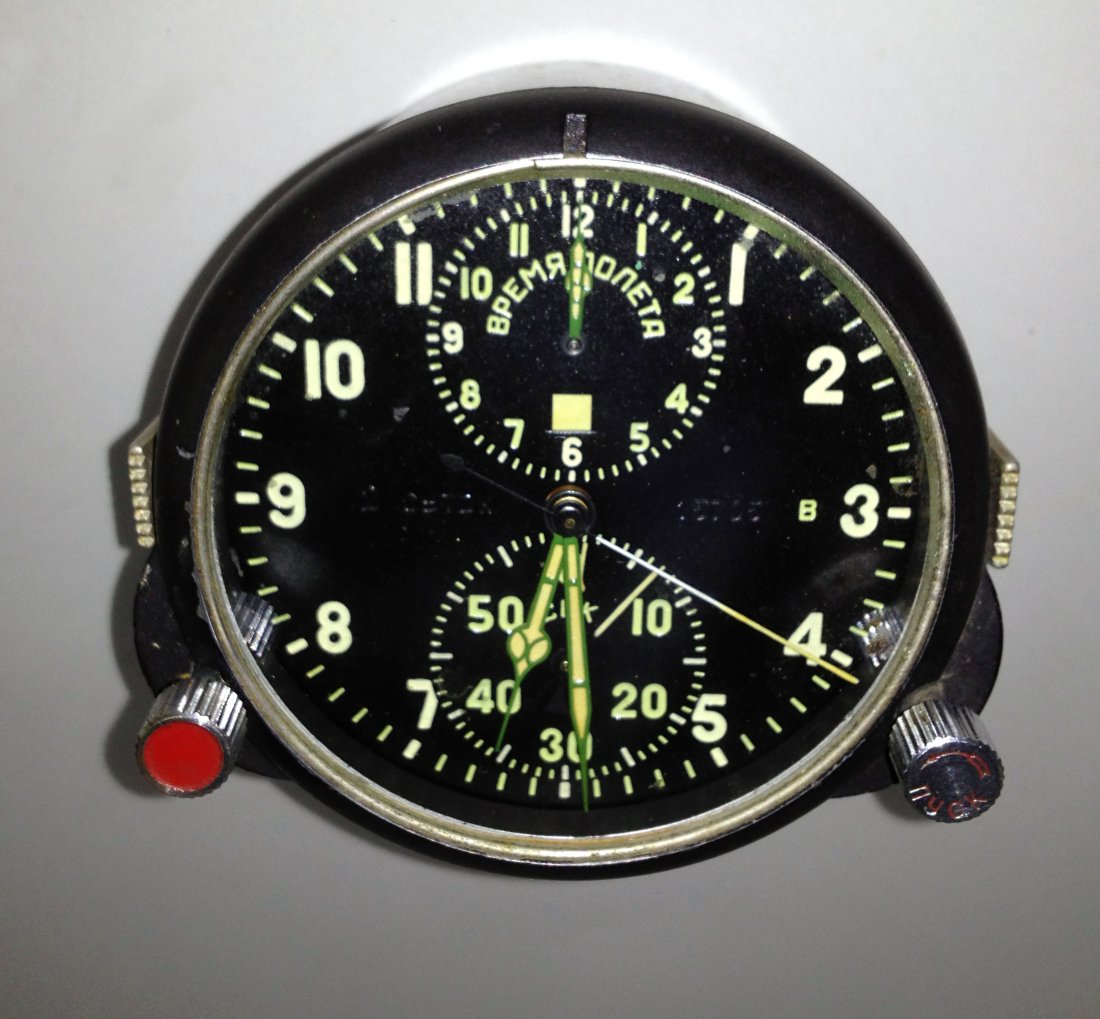 Russian Airplane Clock: With the number 15705 and "2 CYTOK" on the dial. 3 1/2" across and 3 3/4" deep, with features of elapsed time, stopwatch etc. The mechanical lever escapement clock seems to work but maybe one of the f