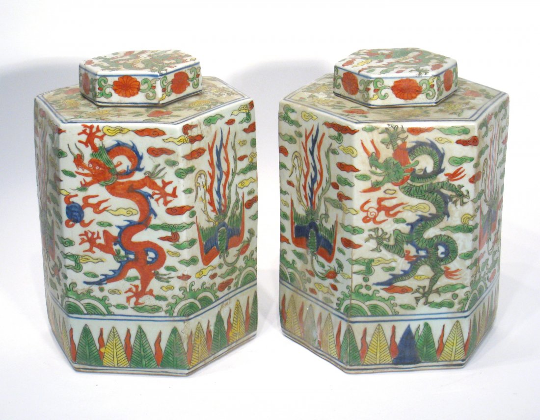 Chinese Porcelain Wan Li Vases: A pair of 10 1/2" lidded poly glazed porcelain hex angular jar vases with Wan Li mark on the bottom. Shipping: We are able to pack and ship this item to an address in the United States for $55.00 via