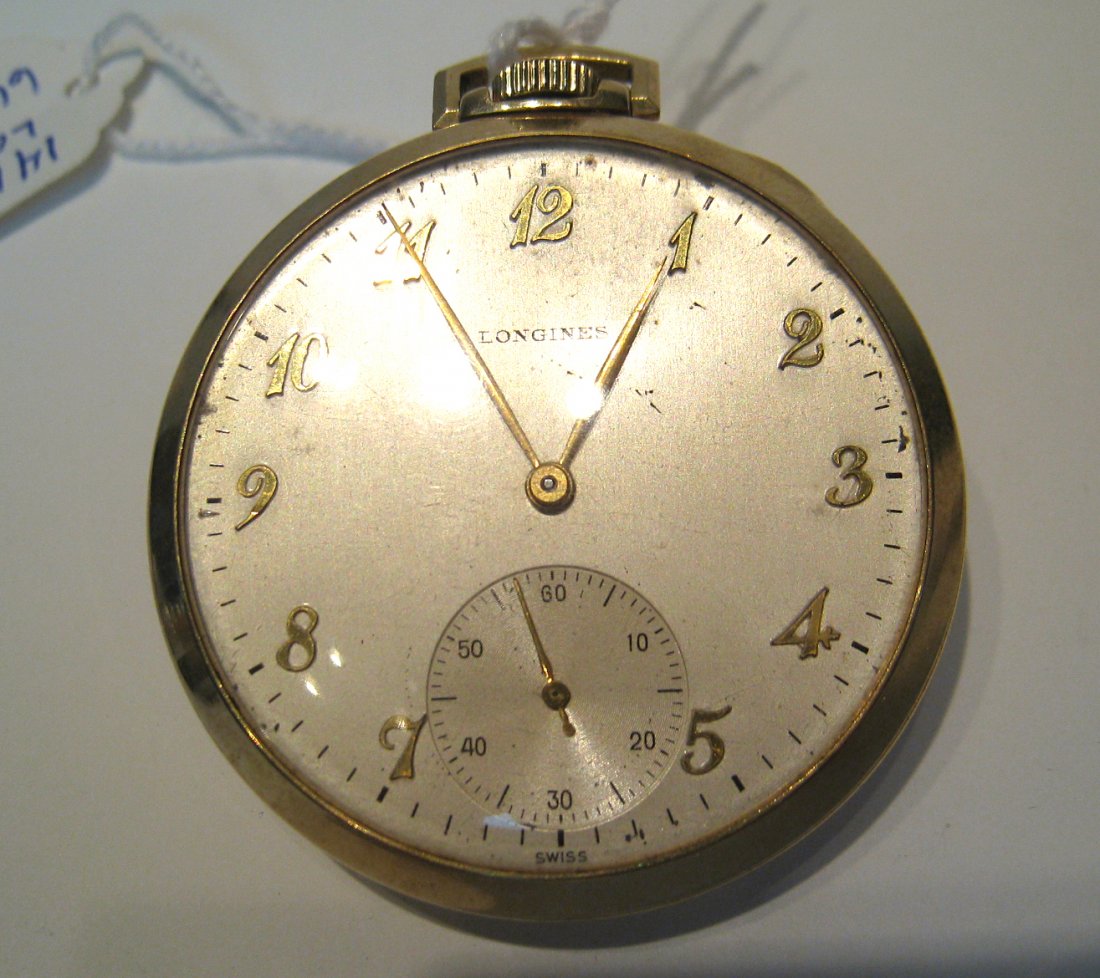 14k Dress Watch By Longines: A 17 jewel 43 mm open faced dress pocket watch stamped "Cased and timed in the USA by Longines 14K. The watch # 6677231 is running well. Shipping: We are able to pack and ship this item to an address