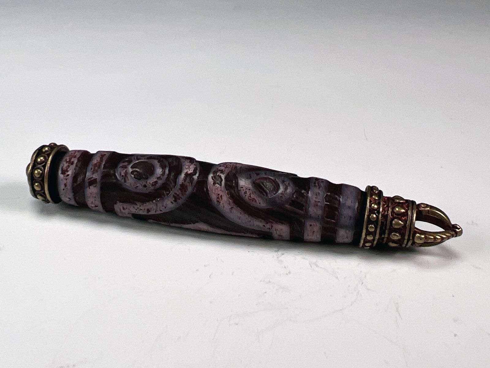 TIBETAN STYLE DZI BEAD WITH VAJRA CAP (1 of 3)