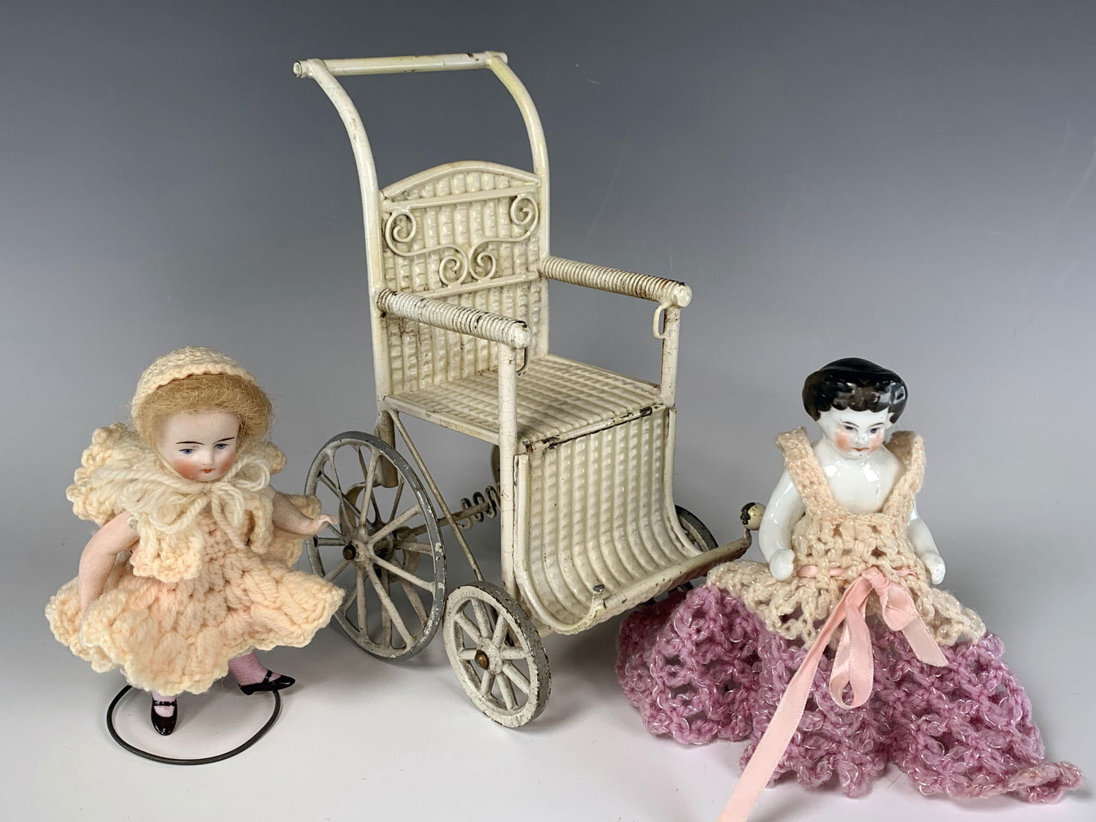 TINY ANTIQUE PORCELAIN DOLLS AND WHEELCHAIR (1 of 4)