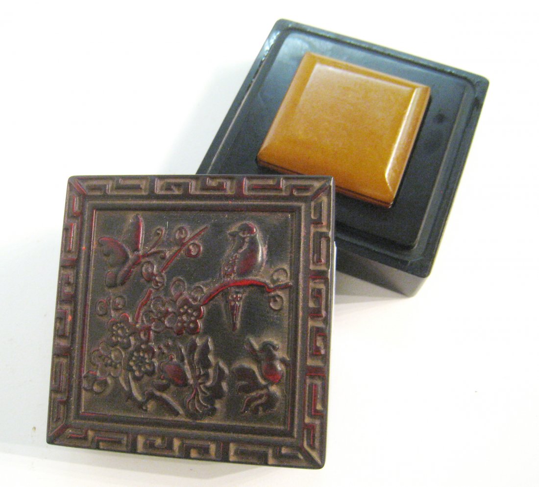 Soapstone Seal In Red Lacquer Box: A 2 3/4" square lidded box with a soapstone seal. Shipping: We are able to pack and ship this item to an address in the United States for $25.00 via USPS Priority Mail. Tracking information will be se