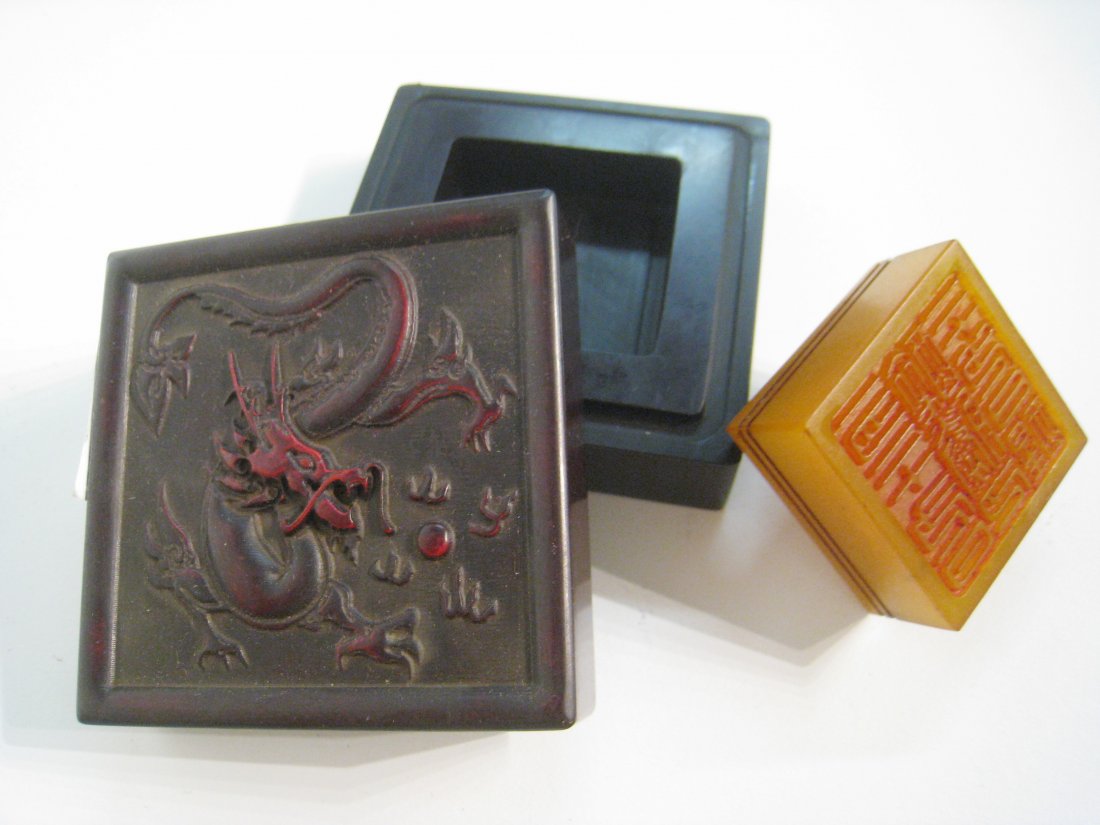 Soapstone Seal In Lacquer Box: hinese, 19th C., 2 3/4" square. Shipping: We are able to pack and ship this item to an address in the United States for $25.00 via USPS Priority Mail. Tracking information will be sent to your email a