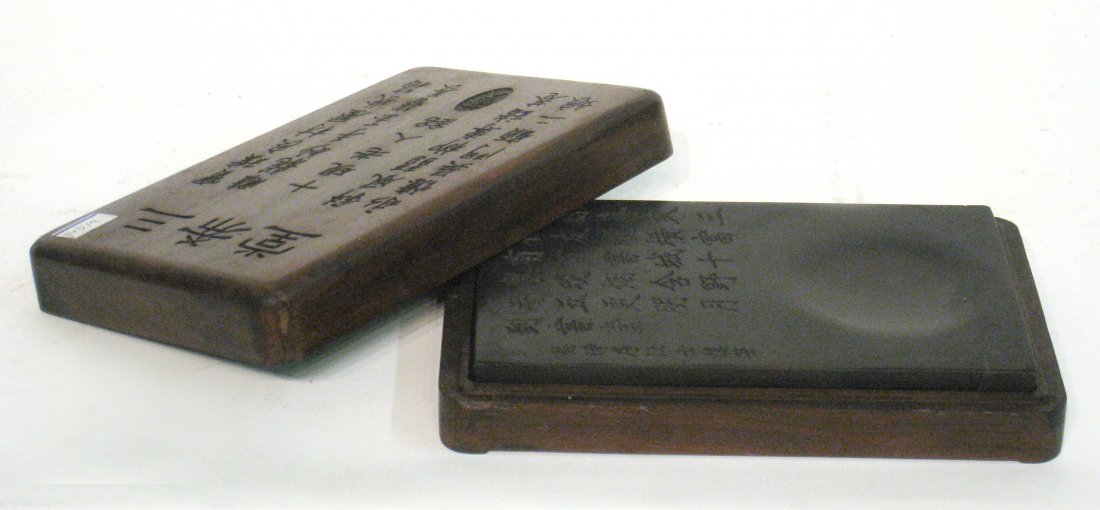 Chinese Inkstone: In a fitted box, 10" x 6 3/4", with carved in calligraphy on both the box top and stone. Shipping: We are able to pack and ship this item to an address in the United States for $30.00 via USPS Priorit
