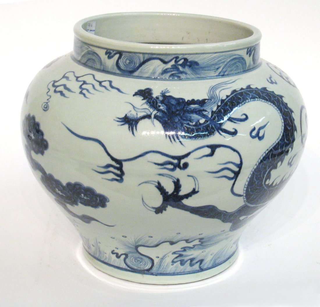 Chinese Yuan Dynasty Style Porcelain Jar: Measuring 11 1/2" X 13 1/2" this porcelain jar features a string image of a dragon with a single stamping on the bottom. Shipping: We are able to pack and ship this item to an address in the United St