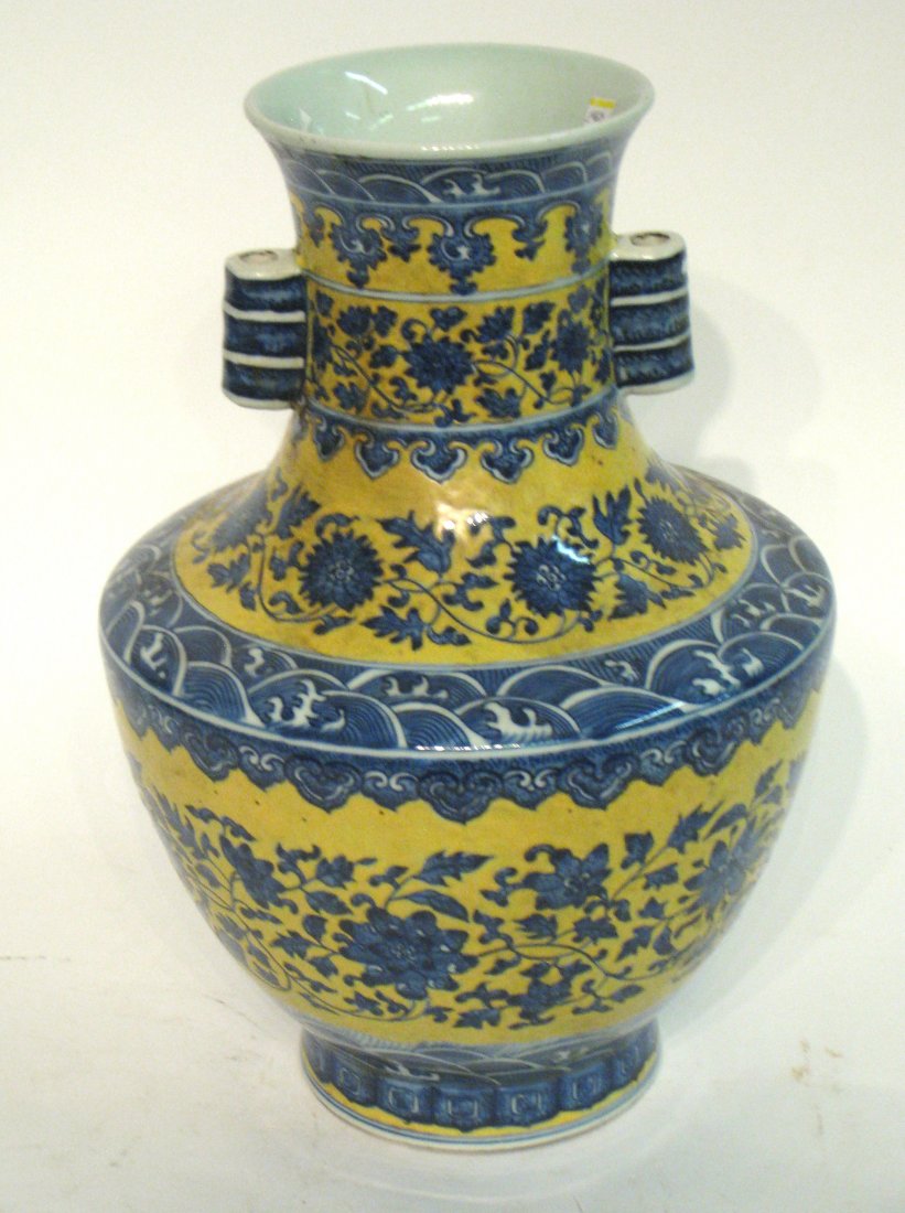 19th C. Chinese Vase: This, with a small hole in base (possibly wired for lamp lighting), and with short handles and in blue, and yellow glaze. 16" Shipping: We are able to pack and ship this item to an address in the Unit
