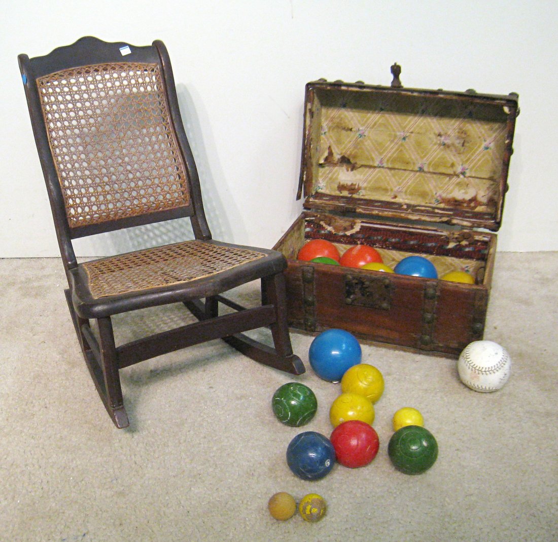 Antique Chest, Vintage Bocce Balls and Child's Rocker: The chest containing bocce balls together with a wicker rocking chair in child's size. Shipping: We are unable to ship this item. Please contact our local UPS Store, store1152@theupsstore.com, for a q